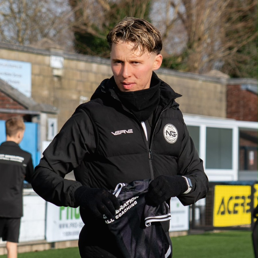 Marcus Daws, founder of NGFC, in branded black kit on the pitch