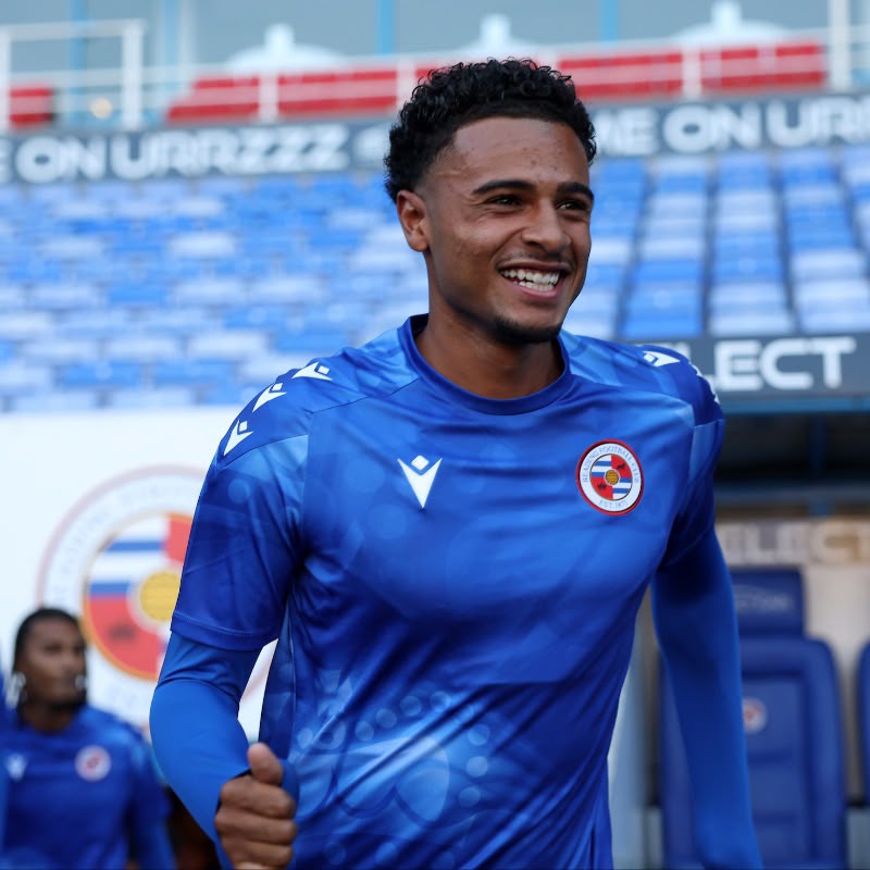 Jay Williams in a blue Reading FC kit at the stadium