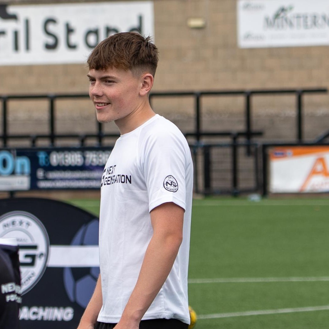 Harvey Ayres coaching an NGFC session in a white Next Generation shirt