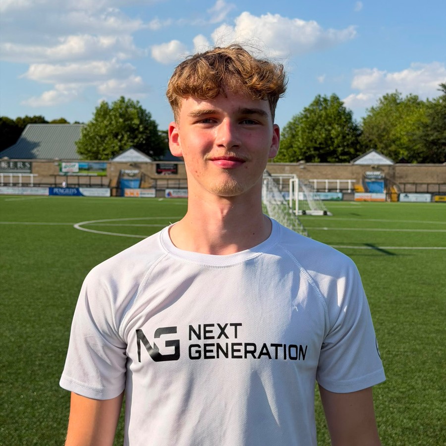 Kobie Dronyk in a white Next Generation shirt on the pitch