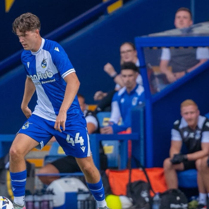Charlie White playing in a blue and white kit during a League Two match
